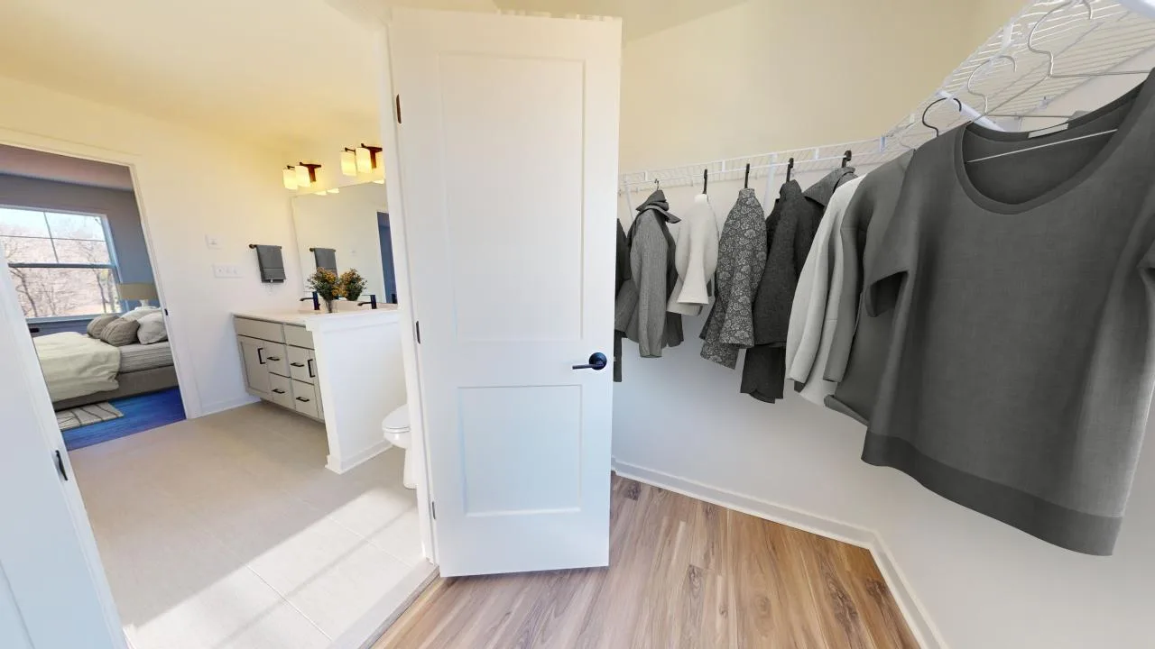 A room with a door open and a white door with a white door and a white door.