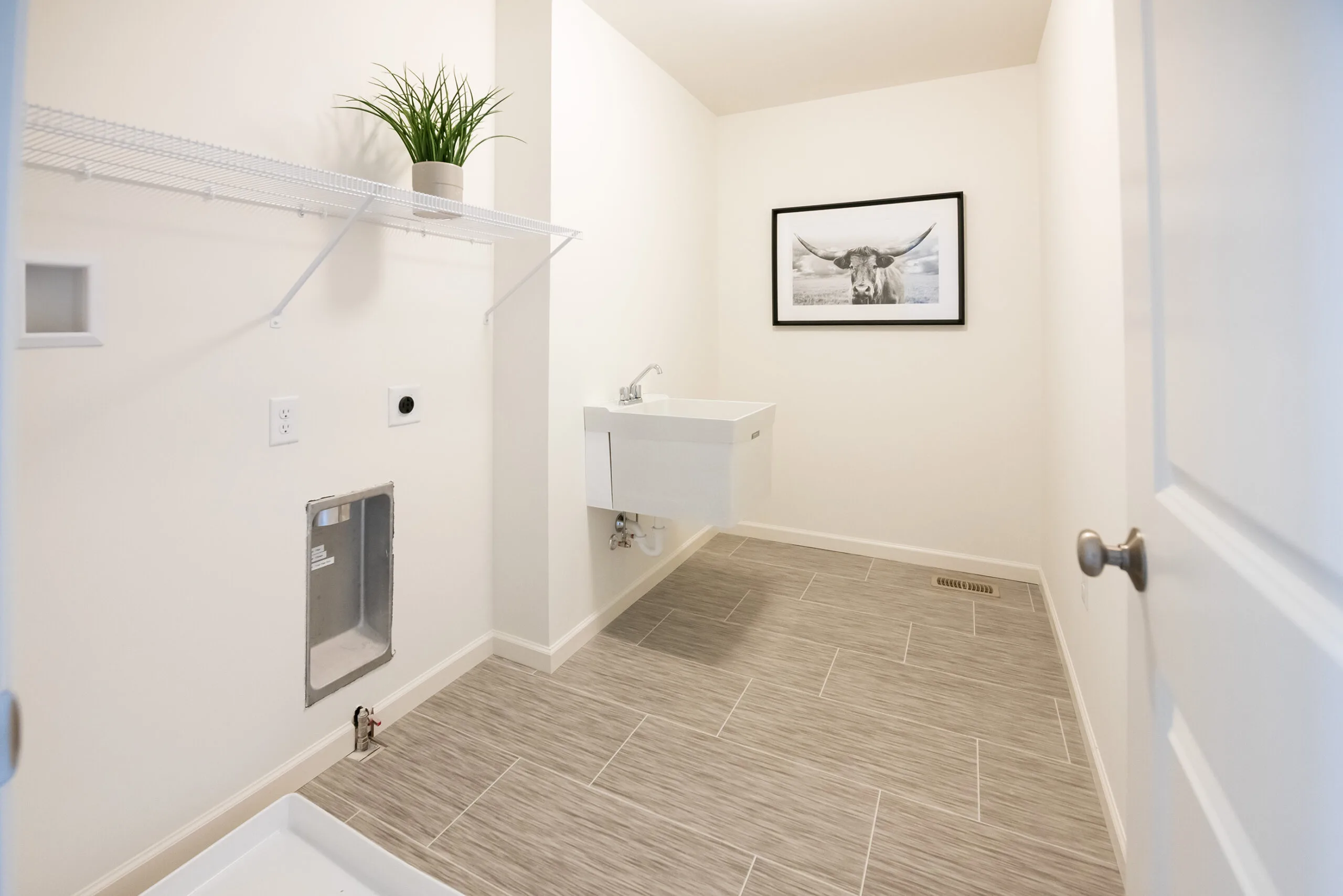 A bathroom with a sink and a sink and a sink.